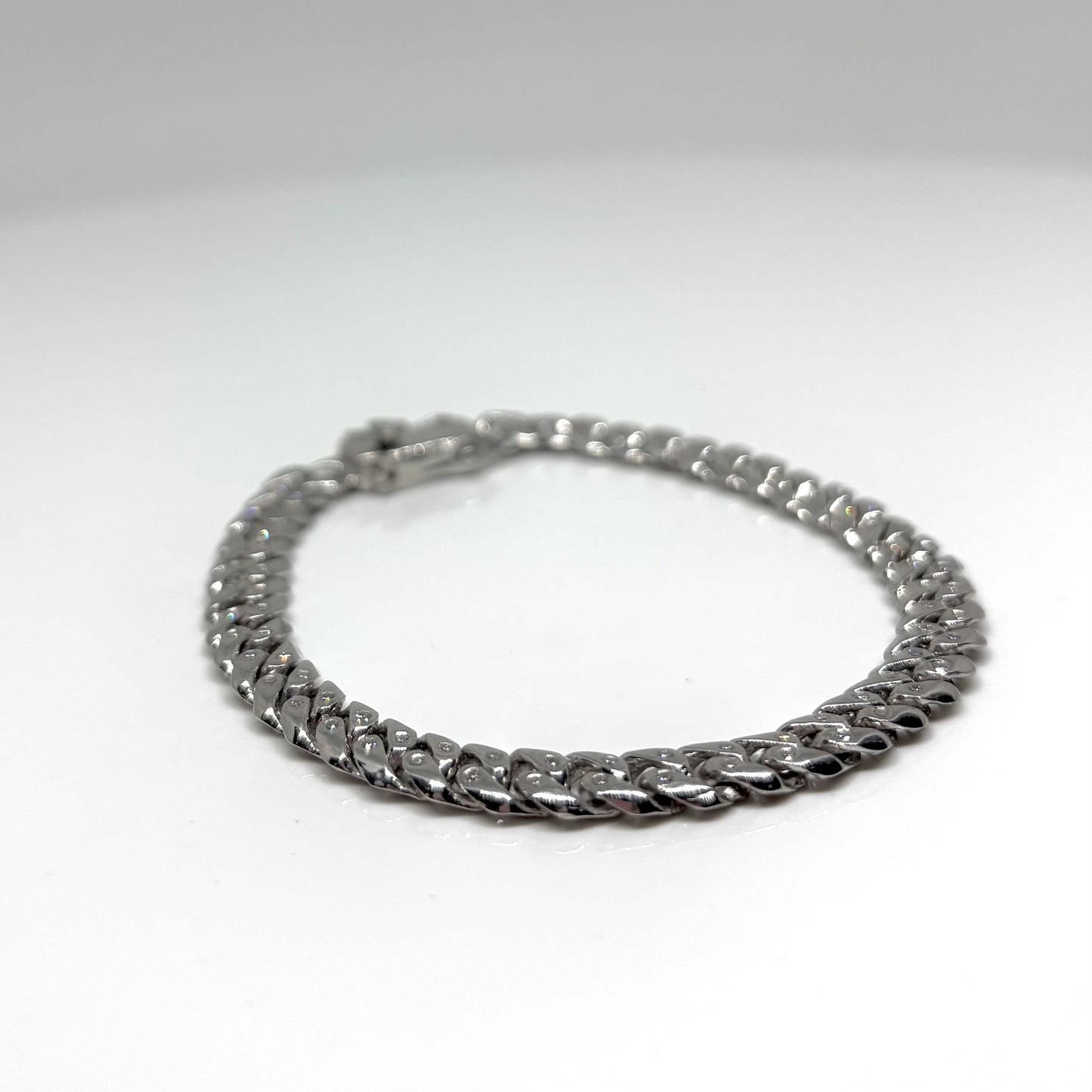 Hand made Cuban Link Bracelet Two stone per link setting Sterling Silver 925. Moissanite stone 18Karat Plated 6.5mm wide 7.5 inch length.