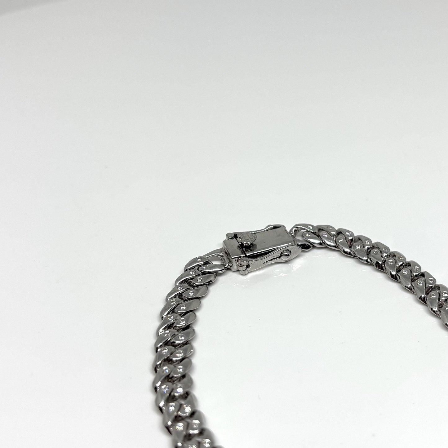 Hand made Cuban Link Bracelet Two stone per link setting Sterling Silver 925. Moissanite stone 18Karat Plated 6.5mm wide 7.5 inch length.