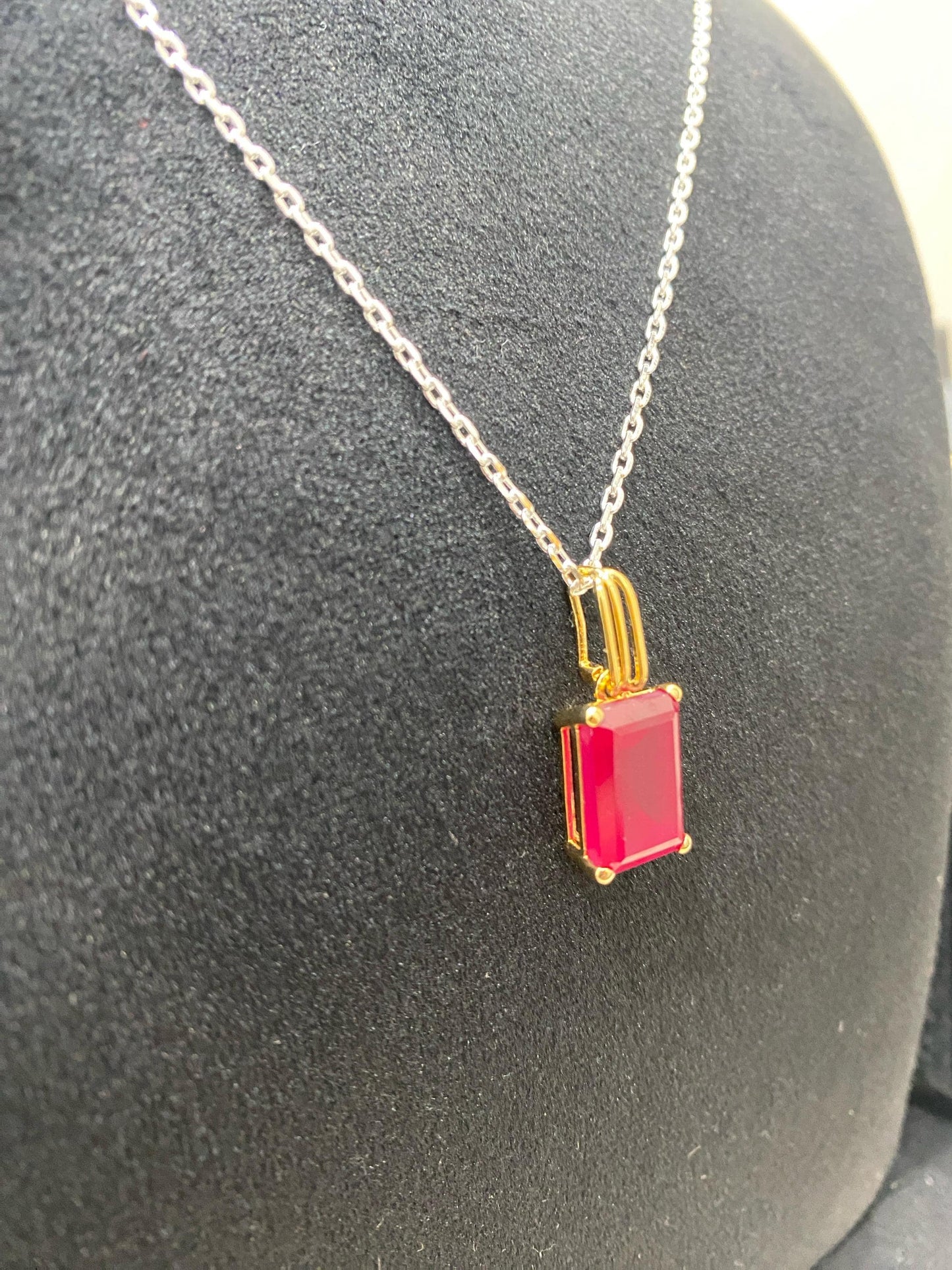Emerald cut red onyx minimal solitaire gem silver pendent.