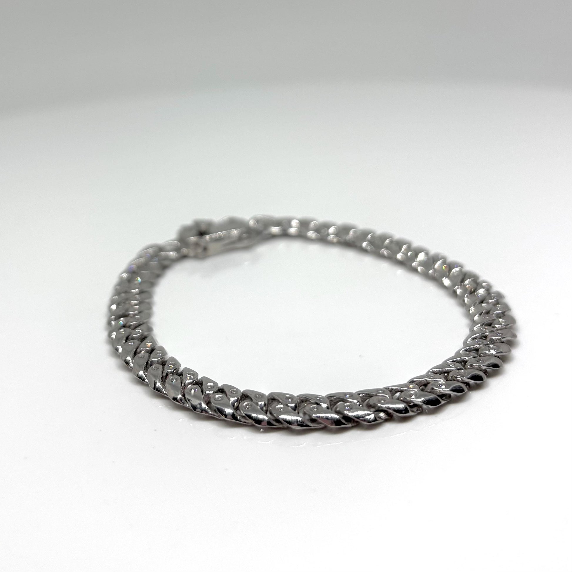 Hand made Cuban Link Bracelet Two stone per link setting Sterling Silver 925. Moissanite stone 18Karat Plated 6.5mm wide 7.5 inch length.