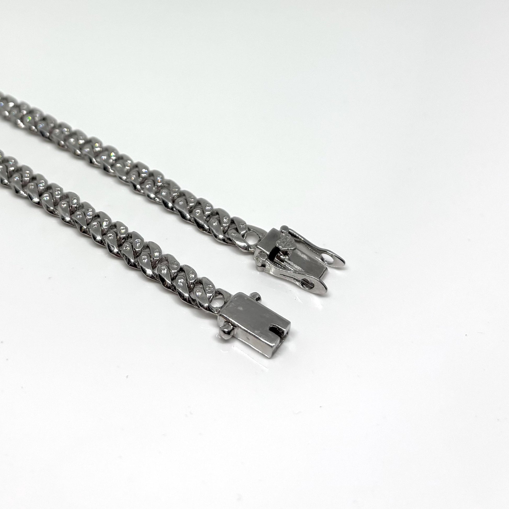 Hand made Cuban Link Bracelet Two stone per link setting Sterling Silver 925. Moissanite stone 18Karat Plated 6.5mm wide 7.5 inch length.
