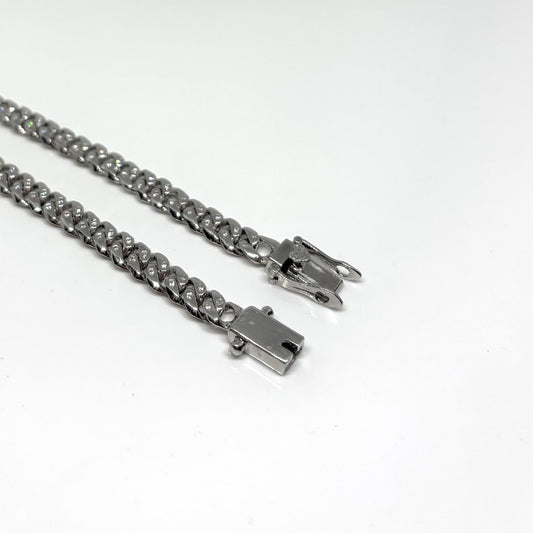 Hand made Cuban Link Bracelet Two stone per link setting Sterling Silver 925. Moissanite stone 18Karat Plated 6.5mm wide 7.5 inch length.