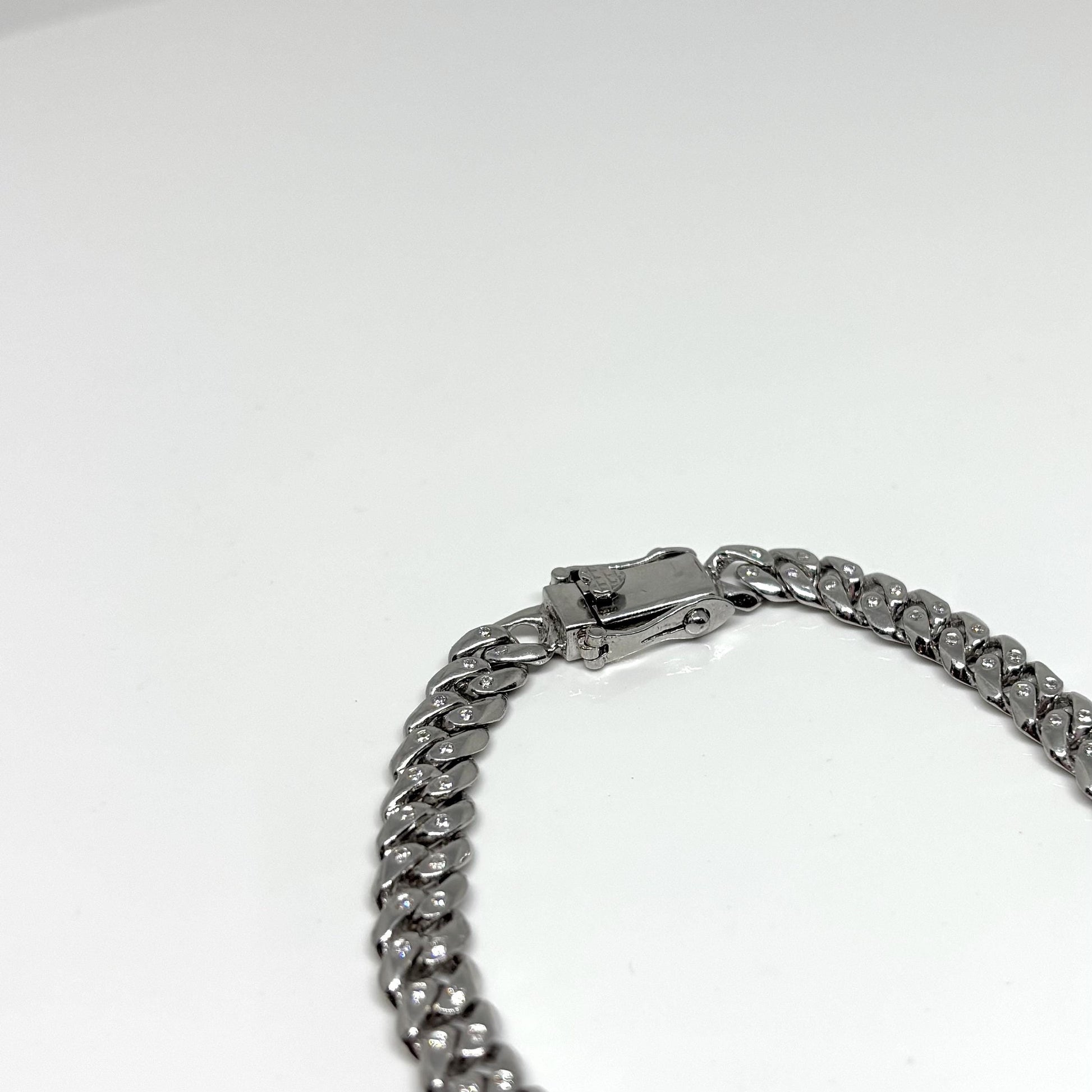 Hand made Cuban Link Bracelet Two stone per link setting Sterling Silver 925. Moissanite stone 18Karat Plated 6.5mm wide 7.5 inch length.