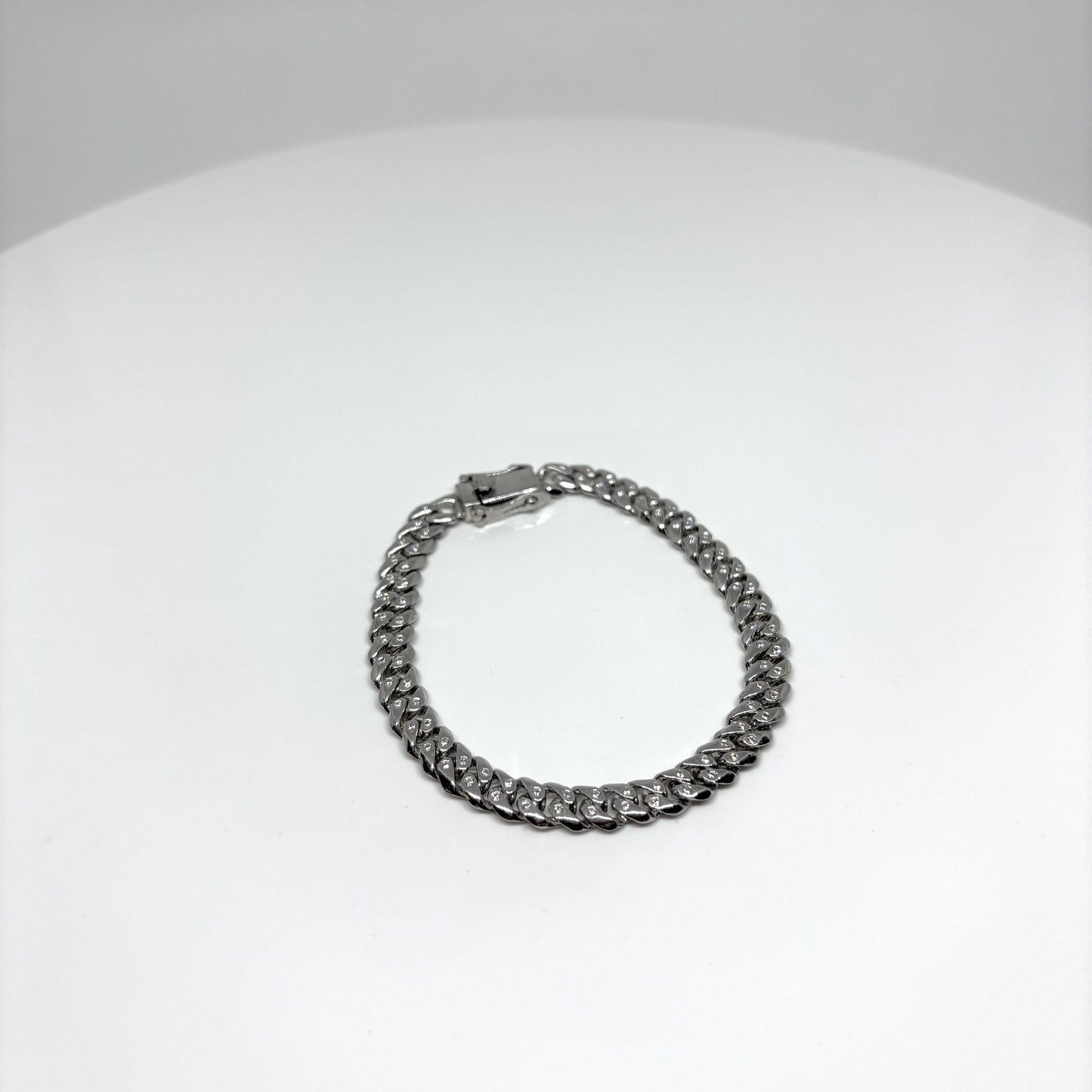 Hand made Cuban Link Bracelet Two stone per link setting Sterling Silver 925. Moissanite stone 18Karat Plated 6.5mm wide 7.5 inch length.